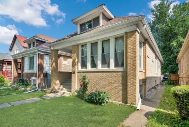 Charming brick bungalow offering 3 bedrooms, 1 full bath, a on Marquette Park Golf Course in Illinois - for sale on GolfHomes.com, golf home, golf lot