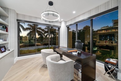 Beyond the private gates of Boca Grove Country Club, a residence on Boca Grove Golf and Tennis in Florida - for sale on GolfHomes.com, golf home, golf lot