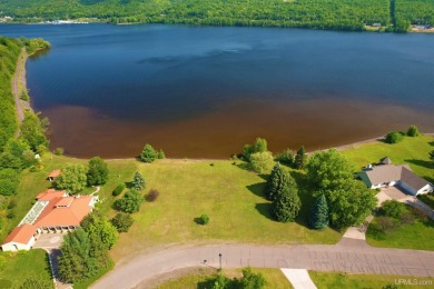 A rare opportunity to own Portage Lake waterfront property in on Portage Lake Golf Course in Michigan - for sale on GolfHomes.com, golf home, golf lot