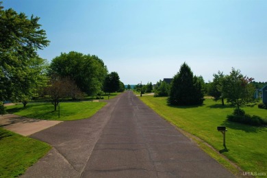 A rare opportunity to own Portage Lake waterfront property in on Portage Lake Golf Course in Michigan - for sale on GolfHomes.com, golf home, golf lot