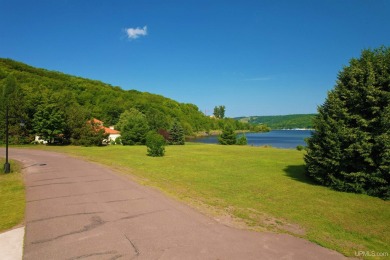 A rare opportunity to own Portage Lake waterfront property in on Portage Lake Golf Course in Michigan - for sale on GolfHomes.com, golf home, golf lot