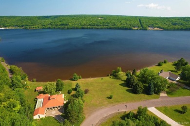 A rare opportunity to own Portage Lake waterfront property in on Portage Lake Golf Course in Michigan - for sale on GolfHomes.com, golf home, golf lot