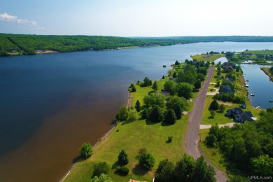 A rare opportunity to own Portage Lake waterfront property in on Portage Lake Golf Course in Michigan - for sale on GolfHomes.com, golf home, golf lot