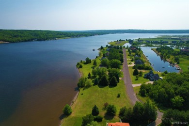 A rare opportunity to own Portage Lake waterfront property in on Portage Lake Golf Course in Michigan - for sale on GolfHomes.com, golf home, golf lot