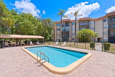 GORGEOUS & PRISTINE WATERFRONT CONDO! PRESTIGIOUS THE FALLS OF on Inverrary Country Club in Florida - for sale on GolfHomes.com, golf home, golf lot