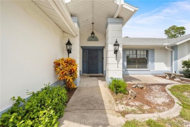 Welcome to this stunning 3-bedroom, 2-bathroom pool home on Oak Hills Country Club in Florida - for sale on GolfHomes.com, golf home, golf lot