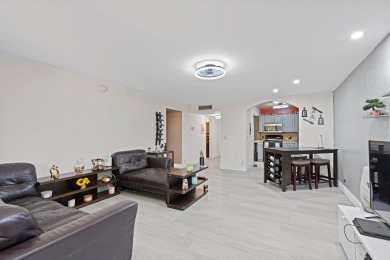 GORGEOUS & PRISTINE WATERFRONT CONDO! PRESTIGIOUS THE FALLS OF on Inverrary Country Club in Florida - for sale on GolfHomes.com, golf home, golf lot