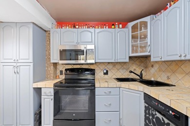 GORGEOUS & PRISTINE WATERFRONT CONDO! PRESTIGIOUS THE FALLS OF on Inverrary Country Club in Florida - for sale on GolfHomes.com, golf home, golf lot