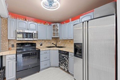 GORGEOUS & PRISTINE WATERFRONT CONDO! PRESTIGIOUS THE FALLS OF on Inverrary Country Club in Florida - for sale on GolfHomes.com, golf home, golf lot