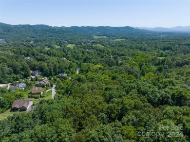 Located in the Reems Creek Golf Community, this 2.77-acre lot on Reems Creek Golf Club in North Carolina - for sale on GolfHomes.com, golf home, golf lot