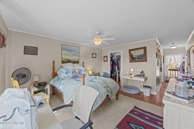 Enjoy stunning waterfront views from this charming 1 bedroom on Harbour Point Golf Club in North Carolina - for sale on GolfHomes.com, golf home, golf lot