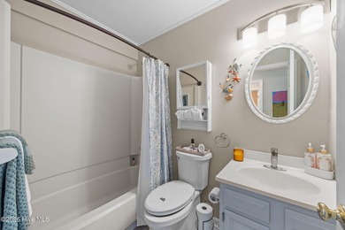 Enjoy stunning waterfront views from this charming 1 bedroom on Harbour Point Golf Club in North Carolina - for sale on GolfHomes.com, golf home, golf lot