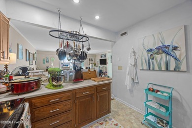 Enjoy stunning waterfront views from this charming 1 bedroom on Harbour Point Golf Club in North Carolina - for sale on GolfHomes.com, golf home, golf lot