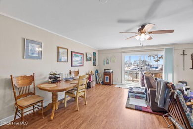 Enjoy stunning waterfront views from this charming 1 bedroom on Harbour Point Golf Club in North Carolina - for sale on GolfHomes.com, golf home, golf lot