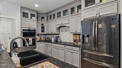 Located minutes from the charming Village of Pinehurst, this on Pinewild Country Club of Pinehurst in North Carolina - for sale on GolfHomes.com, golf home, golf lot