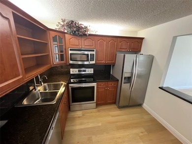 Top floor, corner unit.. Enclosed balcony with brand new Impact on Boca Dunes Golf and Country Club in Florida - for sale on GolfHomes.com, golf home, golf lot