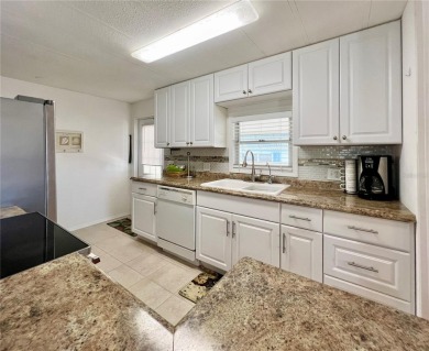 This 2 bedroom, 2 bathroom residence boasts numerous upgrades on Fairway Village Golf Course in Florida - for sale on GolfHomes.com, golf home, golf lot