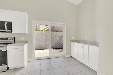 Highly sought-after single-story residence located in the quiet on PGA National Golf Club in Florida - for sale on GolfHomes.com, golf home, golf lot