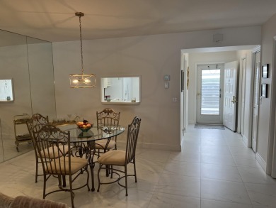 Very desirable bottom floor condo with views of the water, golf on Atlantis Golf Club in Florida - for sale on GolfHomes.com, golf home, golf lot