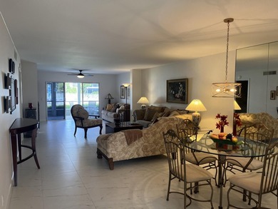 Very desirable bottom floor condo with views of the water, golf on Atlantis Golf Club in Florida - for sale on GolfHomes.com, golf home, golf lot