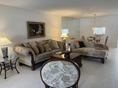 Very desirable bottom floor condo with views of the water, golf on Atlantis Golf Club in Florida - for sale on GolfHomes.com, golf home, golf lot