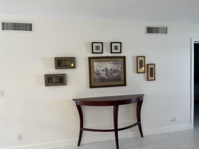 Very desirable bottom floor condo with views of the water, golf on Atlantis Golf Club in Florida - for sale on GolfHomes.com, golf home, golf lot