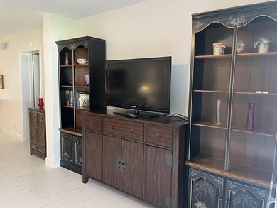 Very desirable bottom floor condo with views of the water, golf on Atlantis Golf Club in Florida - for sale on GolfHomes.com, golf home, golf lot