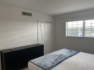 Very desirable bottom floor condo with views of the water, golf on Atlantis Golf Club in Florida - for sale on GolfHomes.com, golf home, golf lot