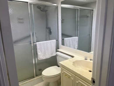 Very desirable bottom floor condo with views of the water, golf on Atlantis Golf Club in Florida - for sale on GolfHomes.com, golf home, golf lot