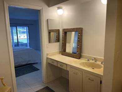 Very desirable bottom floor condo with views of the water, golf on Atlantis Golf Club in Florida - for sale on GolfHomes.com, golf home, golf lot