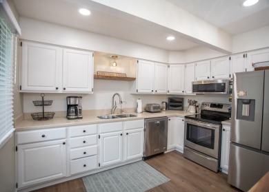 Incredible and updated Trapper Woods condo, nestled in the on Canadian Lakes Country Club-The Pines Course in Michigan - for sale on GolfHomes.com, golf home, golf lot