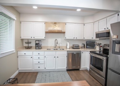 Incredible and updated Trapper Woods condo, nestled in the on Canadian Lakes Country Club-The Pines Course in Michigan - for sale on GolfHomes.com, golf home, golf lot