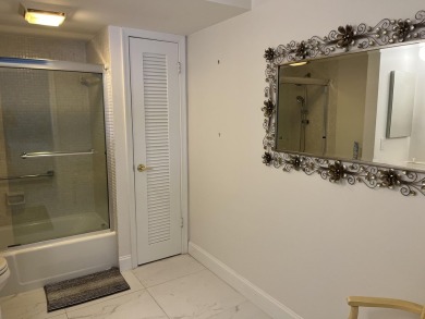 Very desirable bottom floor condo with views of the water, golf on Atlantis Golf Club in Florida - for sale on GolfHomes.com, golf home, golf lot