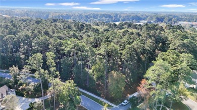 Design your dream home on this spacious corner wooded lot in the on Berkeley Hall Golf Club in South Carolina - for sale on GolfHomes.com, golf home, golf lot