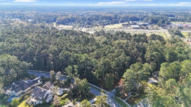 Design your dream home on this spacious corner wooded lot in the on Berkeley Hall Golf Club in South Carolina - for sale on GolfHomes.com, golf home, golf lot