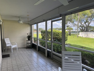 Very desirable bottom floor condo with views of the water, golf on Atlantis Golf Club in Florida - for sale on GolfHomes.com, golf home, golf lot