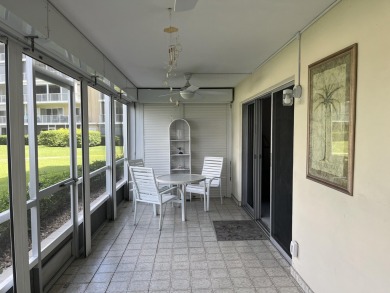 Very desirable bottom floor condo with views of the water, golf on Atlantis Golf Club in Florida - for sale on GolfHomes.com, golf home, golf lot