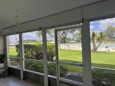 Very desirable bottom floor condo with views of the water, golf on Atlantis Golf Club in Florida - for sale on GolfHomes.com, golf home, golf lot