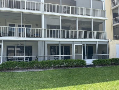 Very desirable bottom floor condo with views of the water, golf on Atlantis Golf Club in Florida - for sale on GolfHomes.com, golf home, golf lot