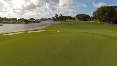 Very desirable bottom floor condo with views of the water, golf on Atlantis Golf Club in Florida - for sale on GolfHomes.com, golf home, golf lot