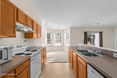 A 3 Bedroom 2 Bathroom Rancher with a 2-car Garage minutes from on Sandpiper Bay Golf and Country Club in North Carolina - for sale on GolfHomes.com, golf home, golf lot