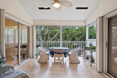 Welcome to an elegantly updated coach home in the prestigious on Bocaire Country Club in Florida - for sale on GolfHomes.com, golf home, golf lot