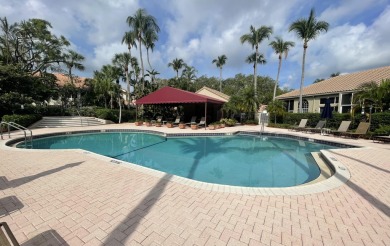 Welcome to an elegantly updated coach home in the prestigious on Bocaire Country Club in Florida - for sale on GolfHomes.com, golf home, golf lot