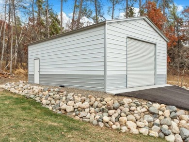 This modern, low-maintenance retreat is perfect for those who on Breezy Point Golf Course Resort in Minnesota - for sale on GolfHomes.com, golf home, golf lot