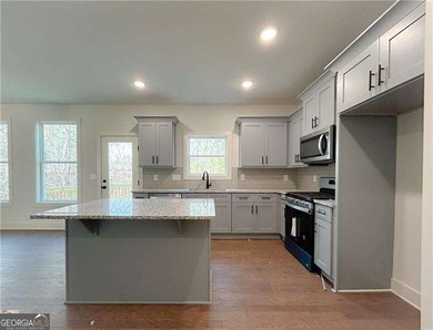 Welcome to 27 Bridgestone Way in the charming Carter Grove on The Plantation Golf Club in Georgia - for sale on GolfHomes.com, golf home, golf lot