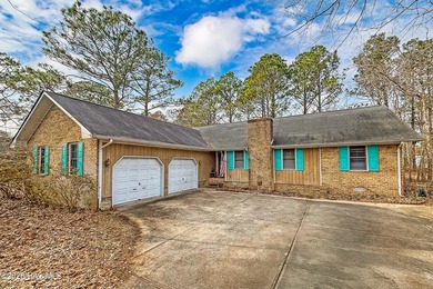 Tucked away on a wooded lot in Fairfield Harbour, this inviting on Harbour Point Golf Club in North Carolina - for sale on GolfHomes.com, golf home, golf lot