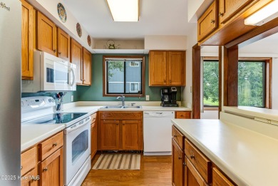Discover the perfect blend of coastal charm and resort-style on Oak Island Golf Club in North Carolina - for sale on GolfHomes.com, golf home, golf lot