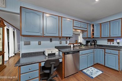 Tucked away on a wooded lot in Fairfield Harbour, this inviting on Harbour Point Golf Club in North Carolina - for sale on GolfHomes.com, golf home, golf lot