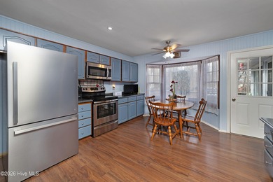 Tucked away on a wooded lot in Fairfield Harbour, this inviting on Harbour Point Golf Club in North Carolina - for sale on GolfHomes.com, golf home, golf lot