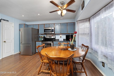 Tucked away on a wooded lot in Fairfield Harbour, this inviting on Harbour Point Golf Club in North Carolina - for sale on GolfHomes.com, golf home, golf lot